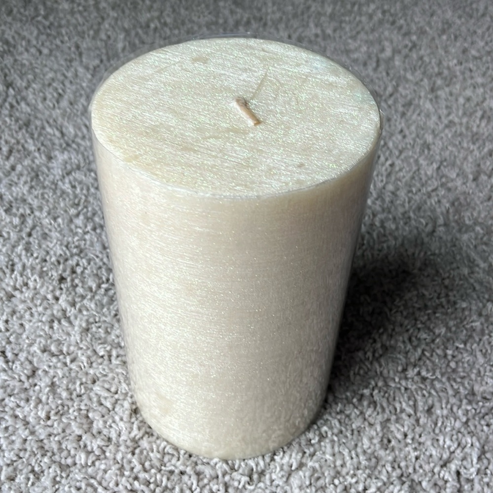 TAG candle 8x5 cream in color with glitter. Brand new!
